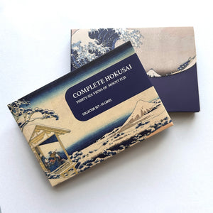 Collection of Hokusai prints with a box labeled 'Complete Hokusai Thirty-Six Views of Mount Fuji'
