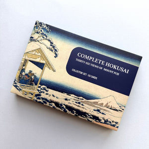 Collection of Hokusai prints with a box labeled 'Complete Hokusai Thirty-Six Views of Mount Fuji'