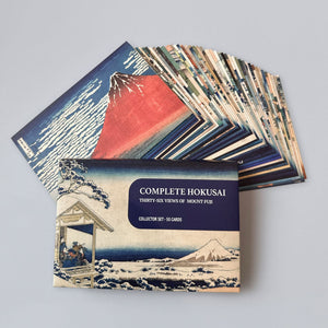 Collection of Hokusai prints with a box labeled 'Complete Hokusai Thirty-Six Views of Mount Fuji'