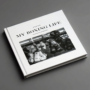 Side angled view of the 56-page My Boxing Life Japan visual narrative book, showing the thickness of the cover and book.