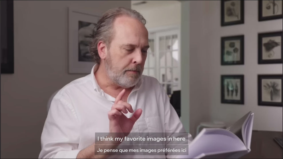 View of Ted Forbes from The Art of Photography holding and reviewing My Boxing Life Japan photobook