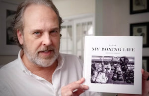 YouTube creator Ted Forbes holding the physical copy of My Boxing Life Japan photobook during a review on his channel, The Art of Photography.